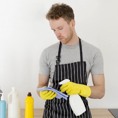 Cleaning expert holding spray