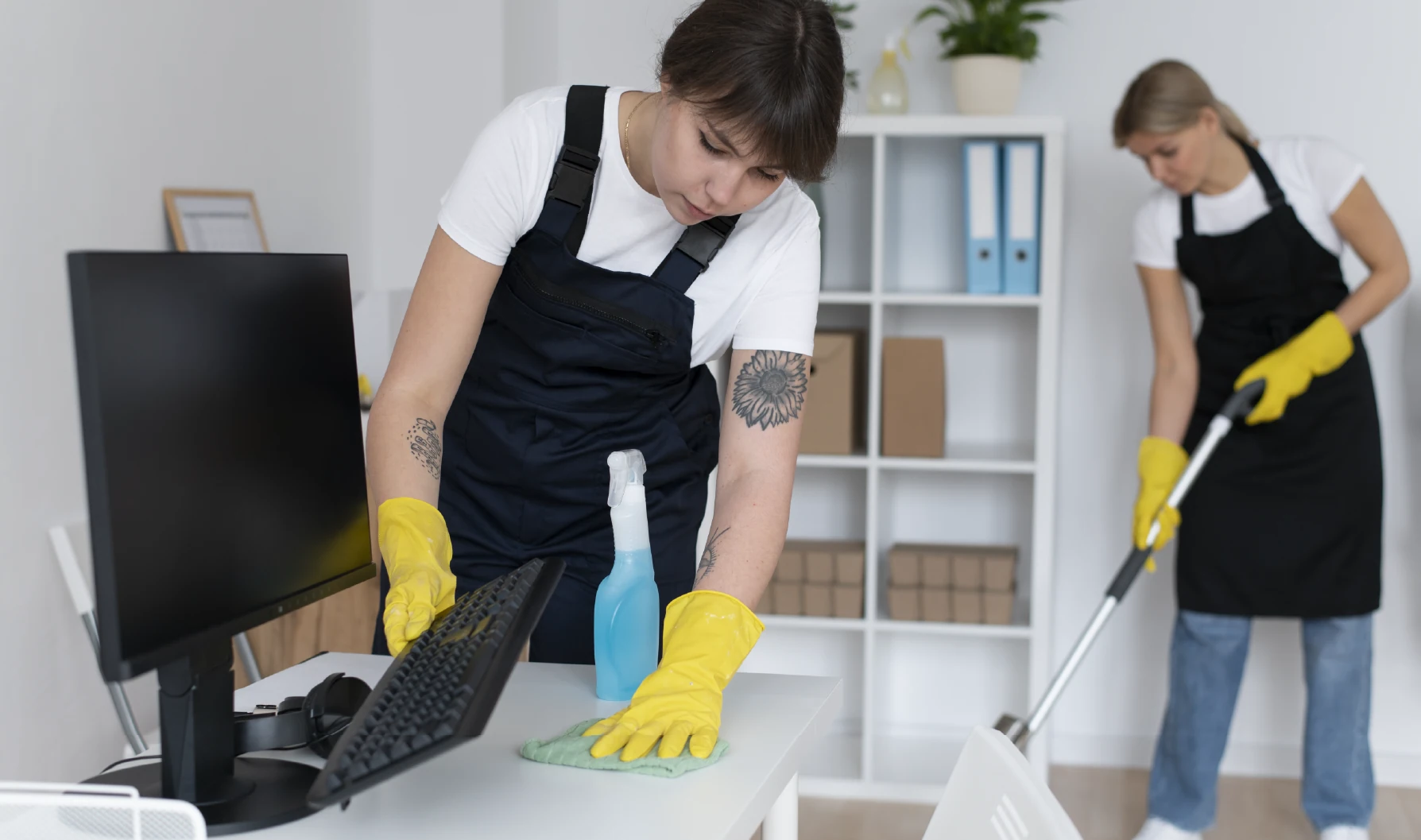 Cleaner wiping office desk