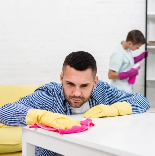 Man wiping white table