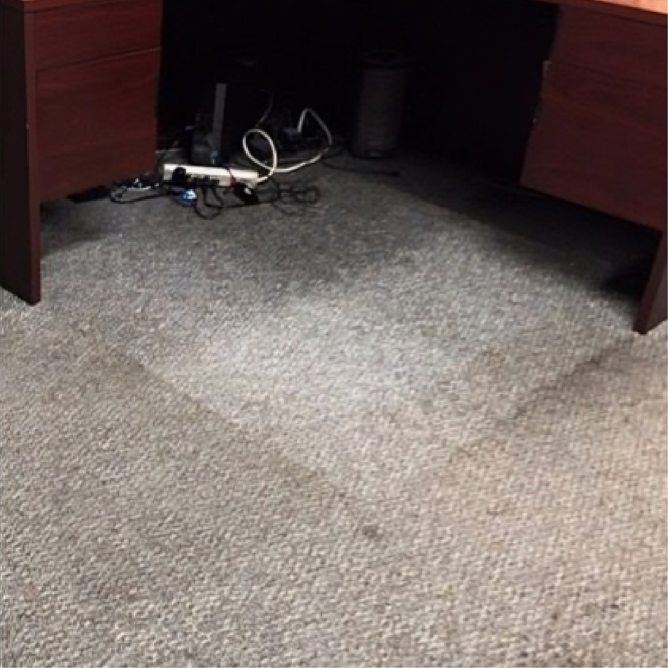 Dirty carpet under desk
