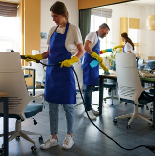 Team cleaning modern office